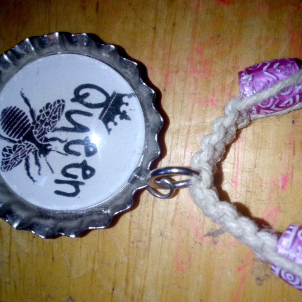 Handmade hemp necklace with Queen charm